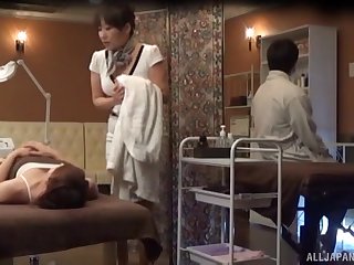 Amateur Japanese woman receives on the top of a simple massage